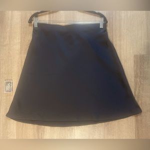 NWT Loft black satin skirt. Never worn. Hidden elastic waistband. Soft fabric.
